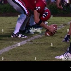 Prior to instruction a teacher/coach lets the football team scrimmage